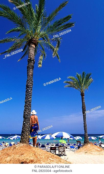 Tourists on beach, Playa den Bossa, Ibiza, Balearic Islands, Spain