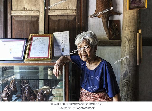 Cambodia, Battambang, Wat Kor Village, Khor Sang House, older Cambodian woman, owner of traditional Khmer wood house built by her grandfather, NR