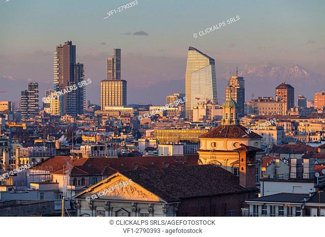 Milan, Lombardy, Italy. The skyscrapers of Milan city at sunset seen from the Cathedral