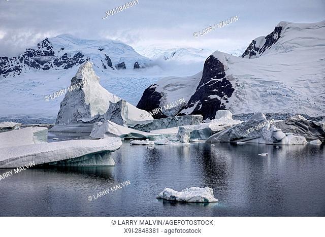 Icebergs, glaciers and mountains along the waters of the Antarctic Peninsula