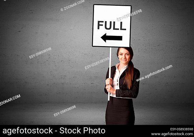 business person holding a traffic sign with FULL inscription, new idea concept