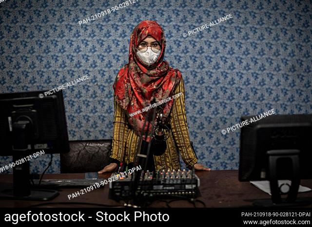 18 September 2021, Afghanistan, Kunduz: 20-year old Afghani radio journalist Nadia Safi poses for a photograph in the studio of Radio Zohra (English: Venus)