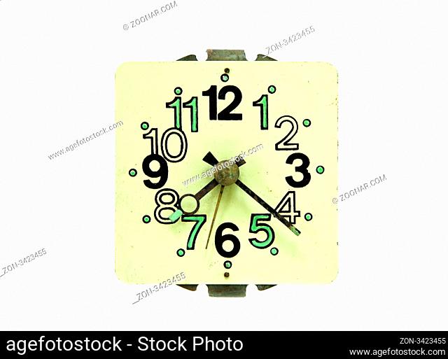 Closeup of old retro vintage alarm clock with arrows and numbers isolated on white