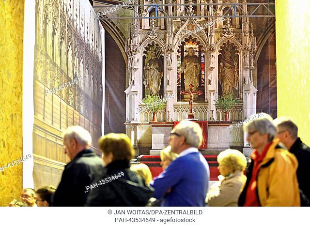 Visitors take a tour of the construction site at All Saints' Church in Wittenberg,  Germany, 08 October 2013. The renovation work on the All Saints' Church and...