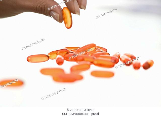 Close up of woman counting pills