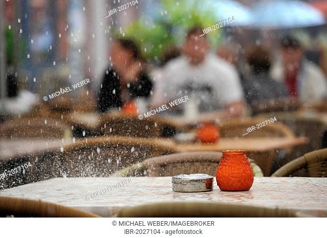 Heavy shower hitting a street restaurant, Hackescher Markt square, Mitte quarter, Berlin, Germany, Europe, PublicGround