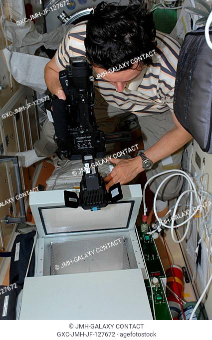 Russian cosmonaut Sergei Revin, Expedition 31 flight engineer, works on the BTKh-26 KASKAD (Cascade) experiment in the Rassvet Mini-Research Module 1 (MRM-1) of...