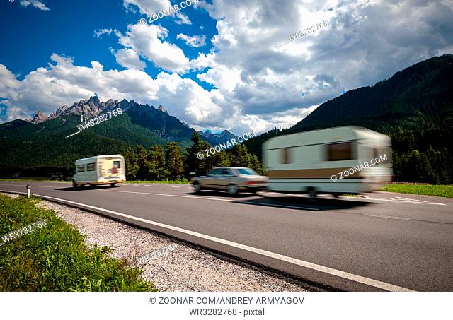 Family vacation travel, holiday trip in motorhome RV, Caravan car Vacation. Beautiful Nature Italy natural landscape Alps