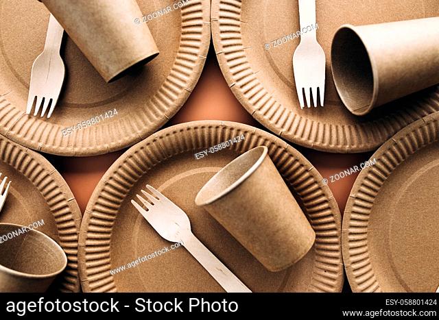 Various eco-friendly kraft paper packaging, fork, cup and plate, containers for takeaway food. Zero waste and recycling concept. High quality photo