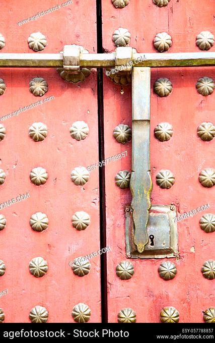 brown  morocco in  africa the old wood facade home and rusty safe padlock