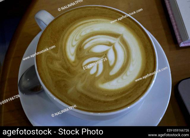 A cup of latte on the table, stock photo