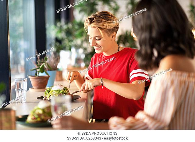 female friends eating at restaurant