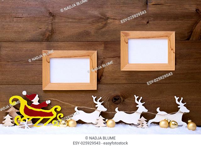 Christmas Card With Decoration Like Red Santa Claus With Yellow Sled And White Reindeer On Snow. Brown Vintage Wooden Background With Two Picture Frame For Copy...