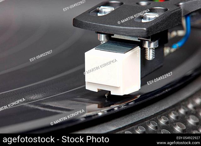Detail shot of a turntable for the retro experience of listening to music