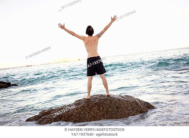 Man Celebrating On Beach