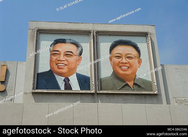 Pyongyang, North Korea, Asia - Two big mosaic pictures depicting the portraits of the late North Korean leaders Kim Il-sung and Kim Jong-il are displayed at the...