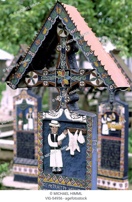 Cementry in Romania. Each of the hand-carved wooden crosses telling the stories of their life or death of the dead. - SAPINTA, RUMAENIEN, 01/06/1997