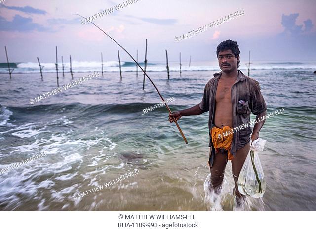 Stilt fisherman at Midigama near Weligama, South Coast, Sri Lanka, Indian Ocean, Asia
