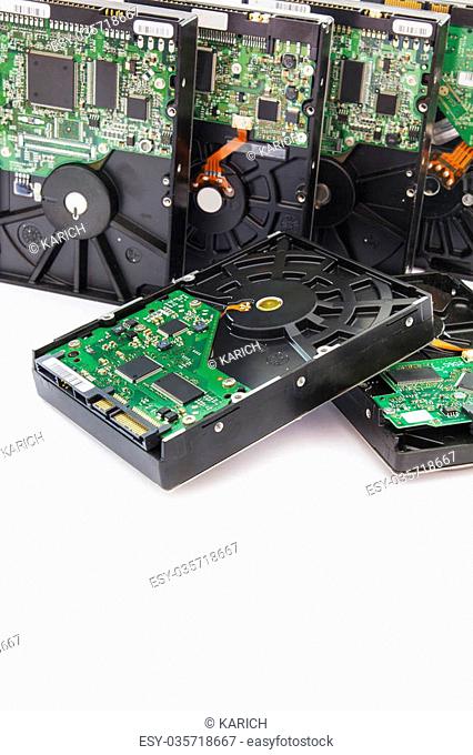 Stack of Old SATA and ATA Hard Disk Drives. Isolated on White Background
