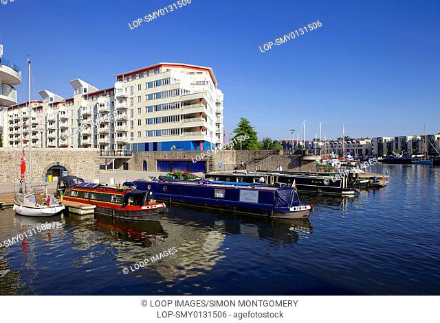 Narrowboats and new buildings along Bristol's harbourside near Hotwells