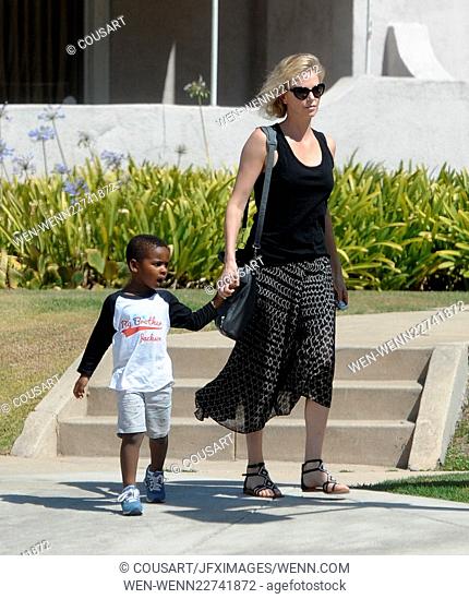 Actress Charlize Theron heads to a friends in Los Angeles house with son Jackson after news of her adopting a baby girl. Featuring: Charlize Theron