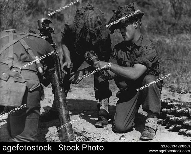 A mortar team of the First Battalion Royal Australian Regiment goes into action during a mortar shoot on the Korean truce line
