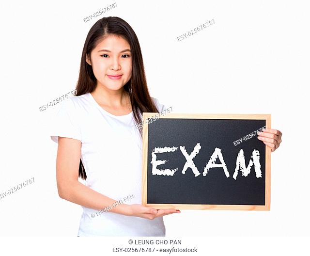 Young lady with black board and showing a word exam