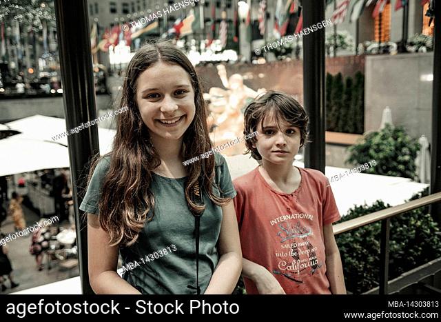 DIAMOND DISTRICT, New York City, NY, USA, 14 years old caucasian teenager girl and 12 years old caucasian teenager boy - both with brown hair and summer styling...
