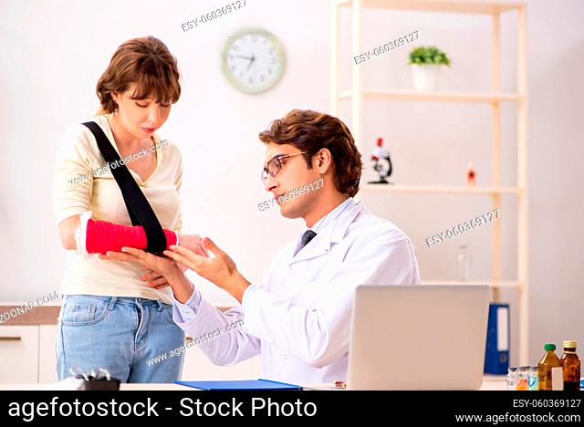 Young woman visiting doctor traumatologist