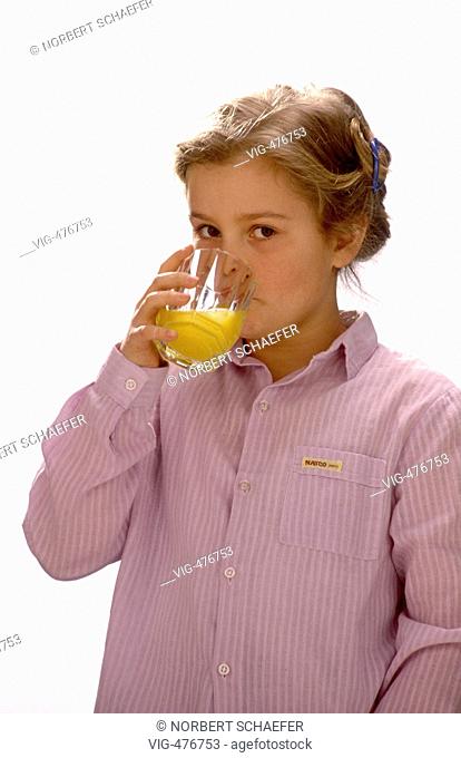 Girls is drinking a glass of orange juice. - 10/08/2007