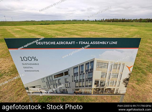 16 May 2023, Saxony, Schkeuditz: A board with a picture of a new aircraft production hall stands at Leipzig/Halle Airport