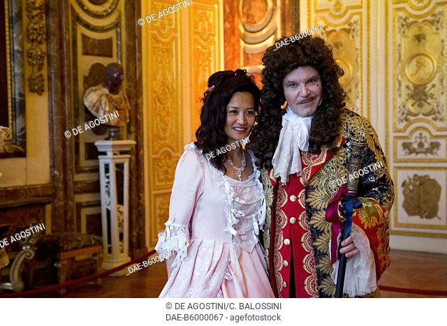 A couple wearing wigs, courtship party (Fete galante) with participants wearing clothes from the Louis XIV period, Palace of Versailles, France