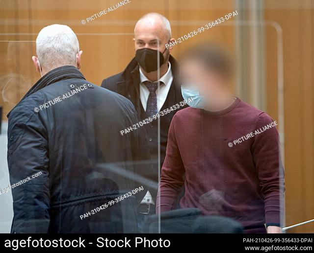 26 April 2021, Baden-Wuerttemberg, Stuttgart: A defendant (r) enters the courtroom before the start of the trial, together with the lawyers Christos Psaltiras...