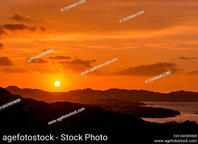 Sun setting beyond Palau in Sardinia
