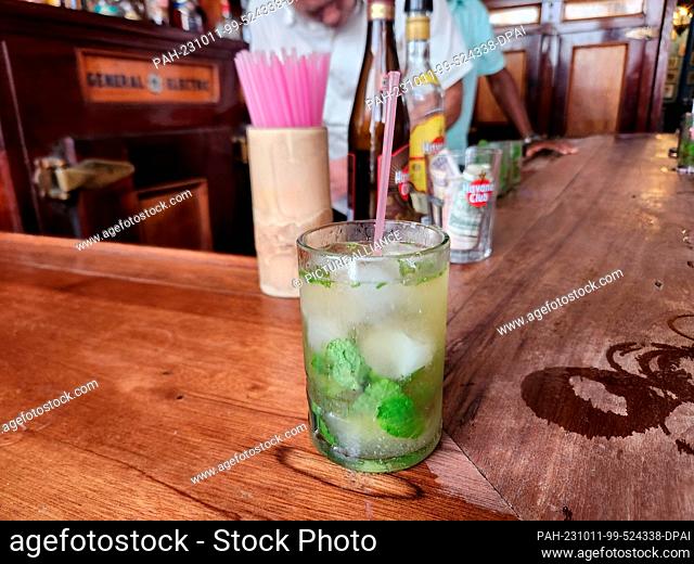 PRODUCTION - 07 October 2023, Cuba, Havanna: In the bar La Bodeguita del Medio in the old town of the Cuban capital, a mojito is served