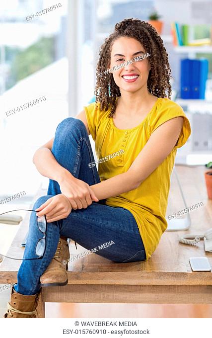 Smiling young businesswoman looking at the camera