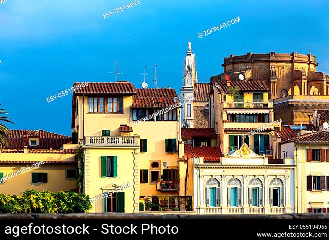 City view with tower, and traditional italian houses near Arno river, Florence, Italy
