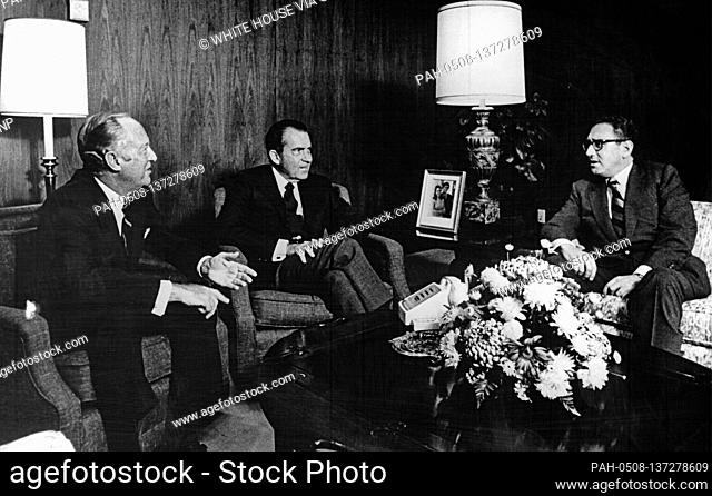 In this photo released by the White House, United States President Richard M. Nixon, center, meets US National Security Advisor Henry A
