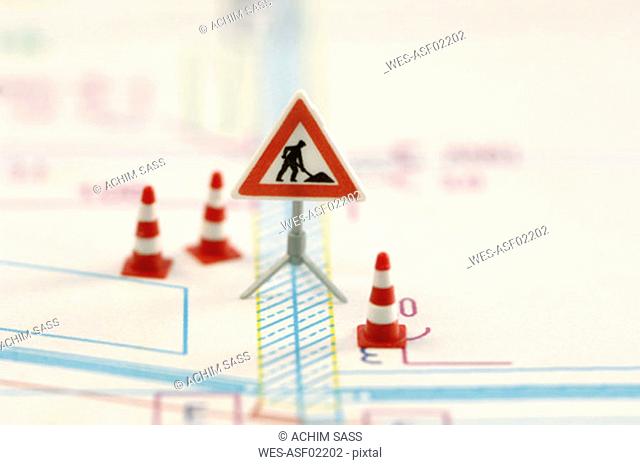 Road construction sign and traffic cone, (selective focus)