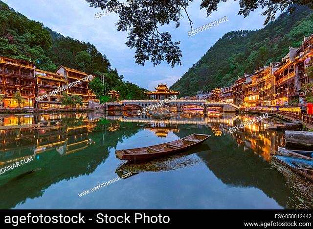 Ancient town Fenghuang at sunset in Hunan China - architecture background