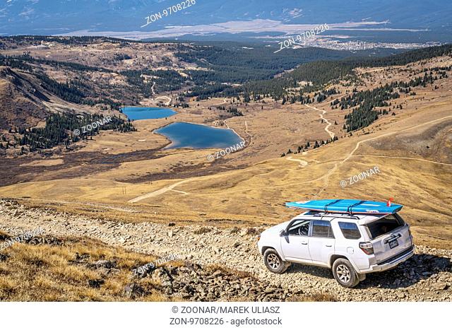 LEADVILLE, CO, USA - SEPTEMBER 27, 2016: Toyota 4Runner SUV (2016 Trail edition) with a paddleboard descending from the Mosquito Pass on a rocky jeep trail in...