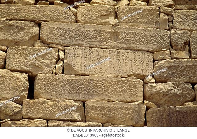 South Arabian alphabet inscriptions on the walls of the fortified city of Baraqish or Barakish (also called Yathul), Yemen. Minaeans civilisation