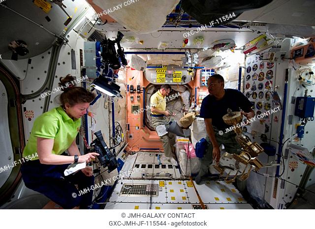 NASA astronaut Cady Coleman and European Space Agency astronaut Paolo Nespoli (background), both Expedition 26 flight engineers; along with NASA astronaut Alvin...