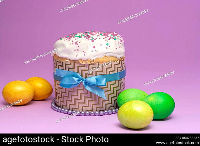 Easter cake pattern with blue ribbon and yellow-green eggs