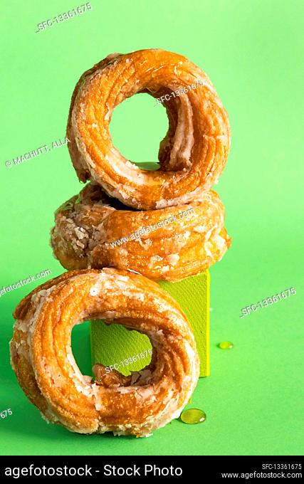 Fried vanilla donuts with sugar glaze in modern colorful style