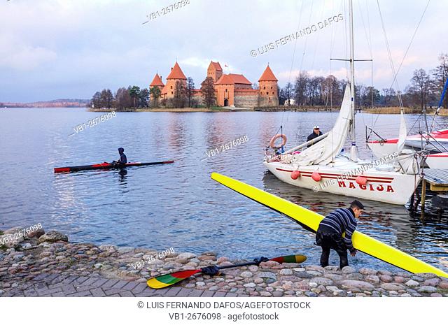 Kayaking in lake Galve with Trakai castle in background. Lithuania