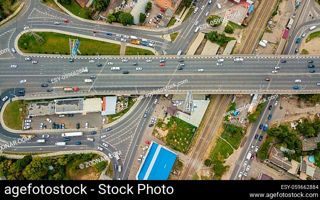 Aerial top view of road junction from above, automobile traffic and jam of many cars