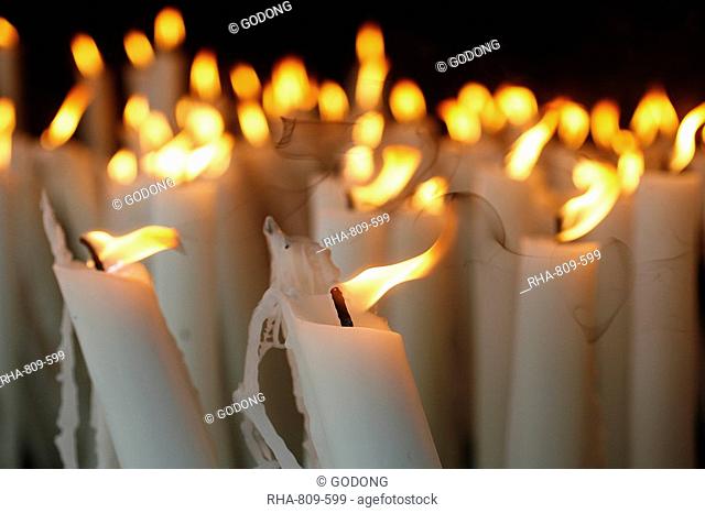 Candles at the Lourdes shrine, Lourdes, Hautes Pyrenees, France, Europe