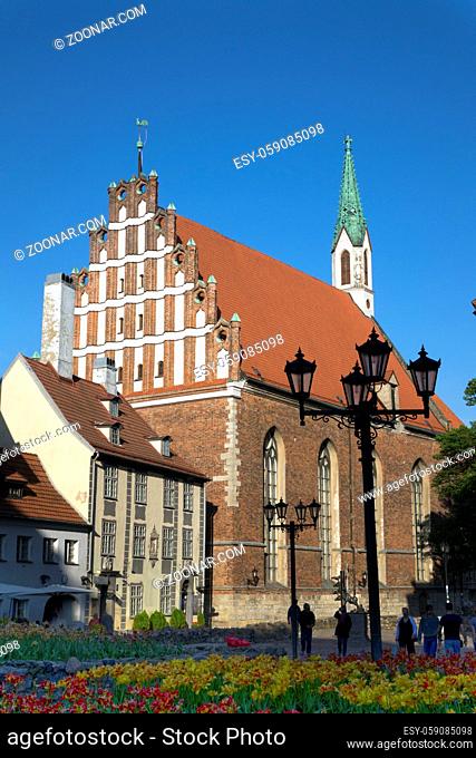 St. John's Church in Riga, Latvia, flowers in the foreground