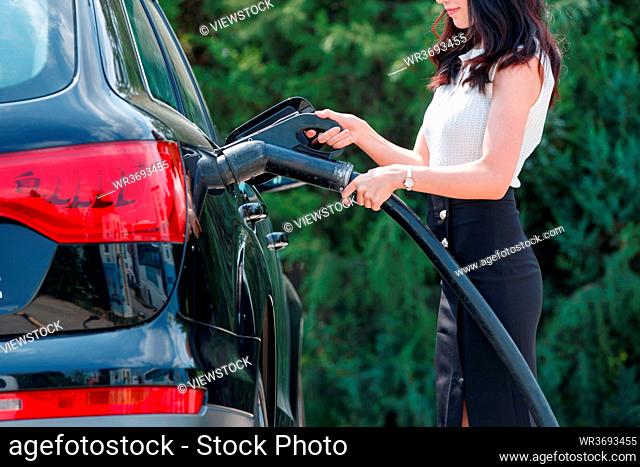 Young women to car battery features